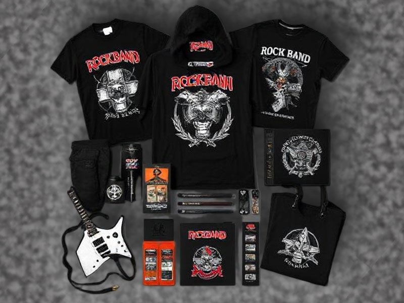DIY band merch table setup featuring black T-shirts, branded lanyards, stickers, and small budget-friendly items like USB sticks and bottle openers, displayed creatively on a compact table with a rock and metal theme.